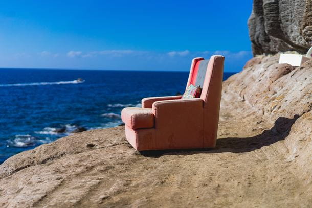 Dirty recliner on the beach